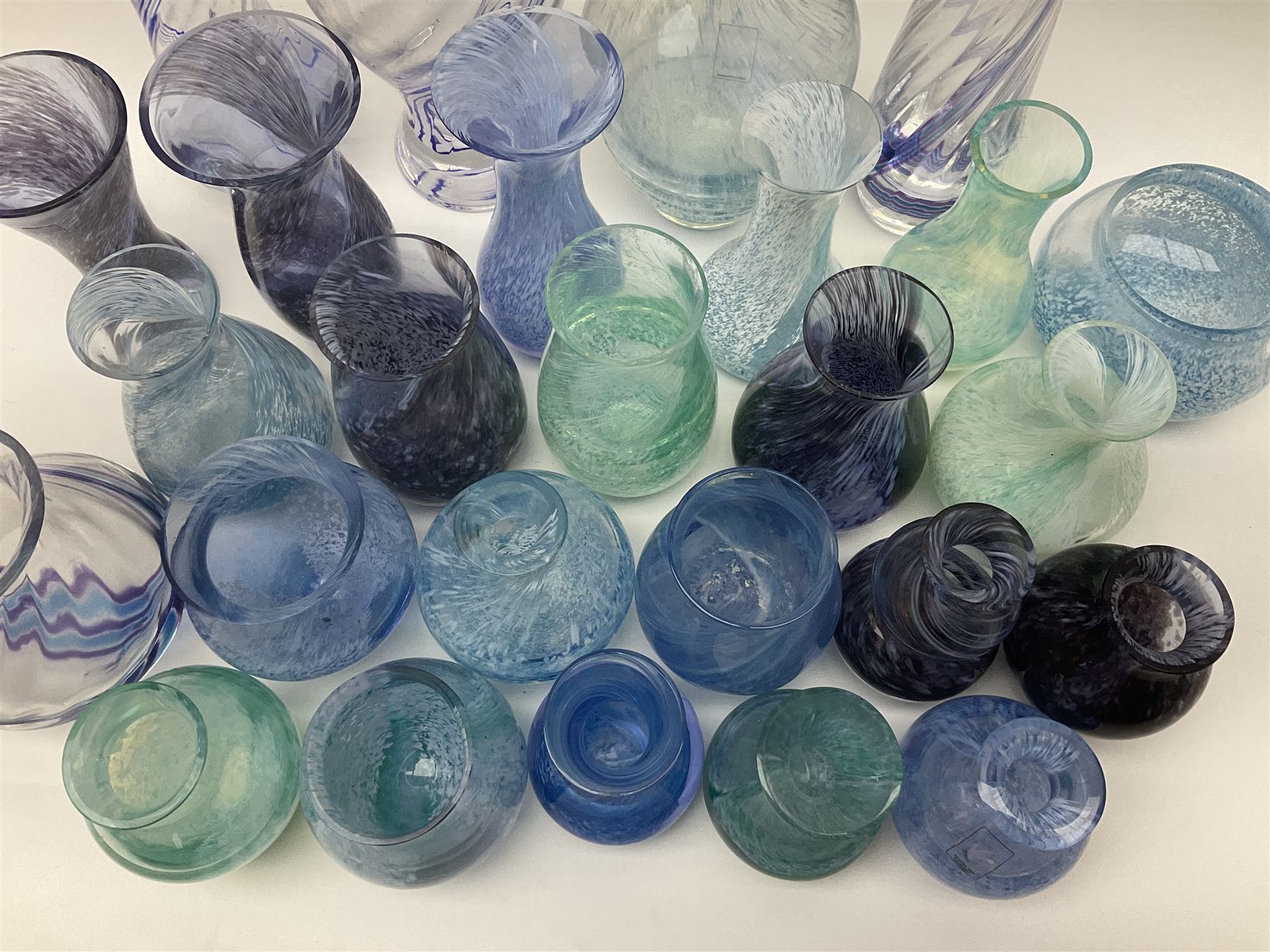 Collection of green/blue Caithness glass vases, to include mottled and swirl designs, largest 20cm (26)