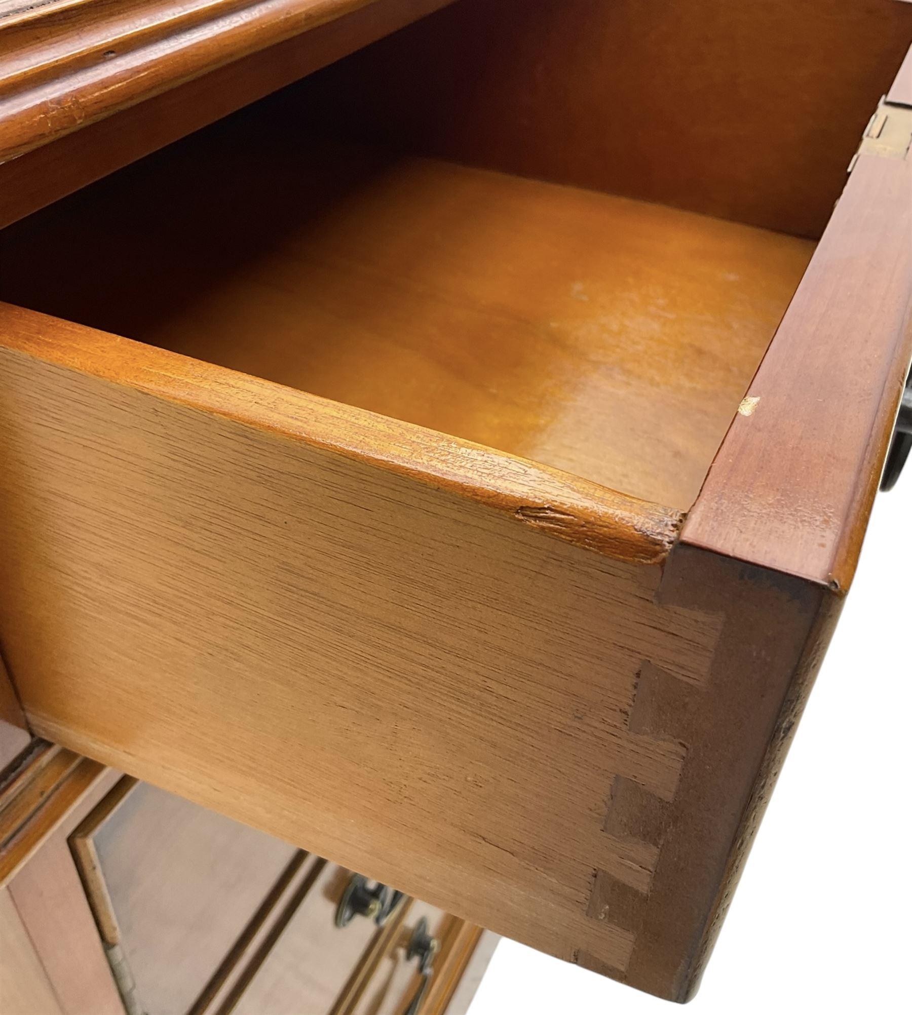 Cherrywood twin pedestal desk, rectangular leather inset top over central fall front with keyboard slide and two drawers, fitted with two drawers and cupboard, on bracket feet