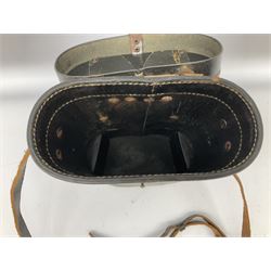 Pair of WWII German U-boat binoculars probably 7 x 50 by Leitz, with rubber eye piece protector covers and leather case stamped with Kriegsmarine mark to the lid and dated 1944, with leather strap.