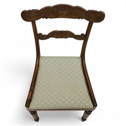 Set of four 19th-century rosewood dining chairs in the William IV style, shaped and carved top rail with fan and scroll decoration above a upholstered padded seat on reeded and turned front legs 