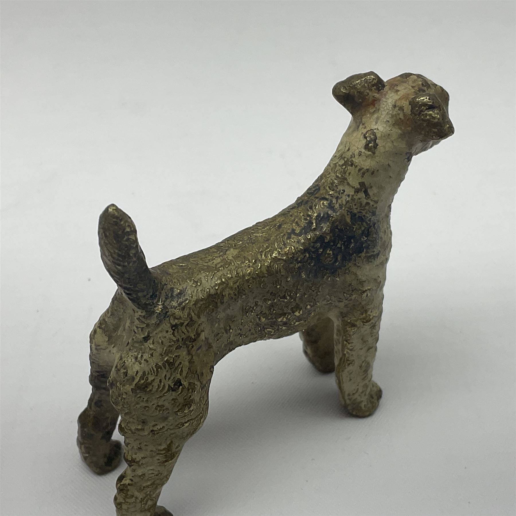 Cold painted bronze model of a seated fox, together with similar standing terrier, fox H5cm