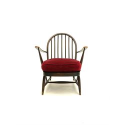 Ercol hoop back low armchair, with upholstered seat, turned supports joined with ‘H’ stretcher 