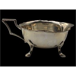 Silver cream jug and two napkin rings, all hallmarked 