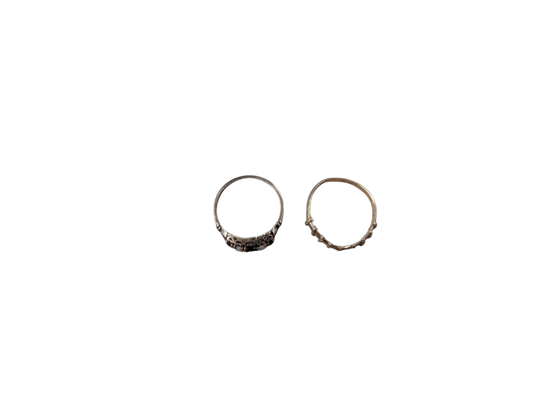 Two 9ct gold rings, comprising wishbone ring and five stone opal and garnet ring, both hallmarked