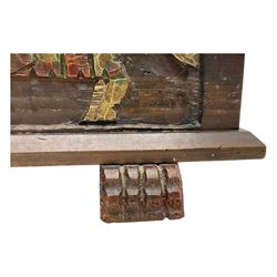Mid-20th century carved hardwood chest, the rectangular hinged top with decorative strap hinges, the front and sides deeply carved with medieval-style jousting knights, heraldic shields, and architectural elements, raised on shaped block feet
