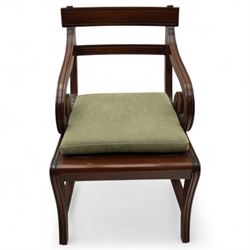 In the manner of Morgan & Sanders - early 20th century Regency design mahogany metaphoric library chair and steps, rectangular panelled top-rail with applied roundels with scrolling arms and upholstered seat and cushion, hinged and folding design transforming into four carpeted steps

Reference: The present lot is based on a design for a metamorphic library chair published by Morgan & Saunders circa 1810, P.Agius, Ackermann's Regency Furniture & Interiors, plate 29, page 60