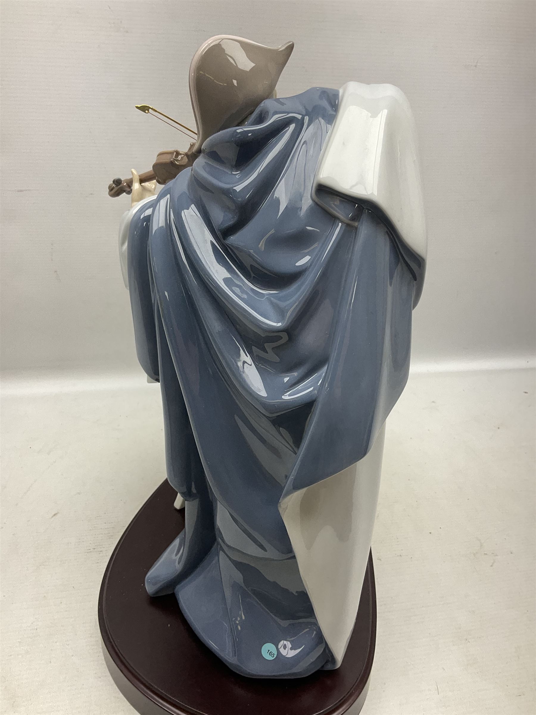 Lladro figure, Jester Serenade, modelled as a ballerina with bouquet of flowers seated before a jester playing the violin, limited edition 2541/3000, sculpted by Antonio Ramos, no 5932, with original box, year issued 1993, year retired 1994, H37cm