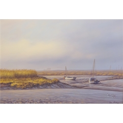  Ian McKie (British 20th/21st century): Fishing Boats resting on the Mud Flats, acrylic on canvas signed 42cm x 60cm  