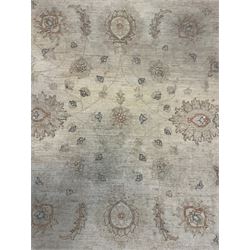 Persian Zeigler rug, ivory ground and decorated with stylised plant motifs, floral design border