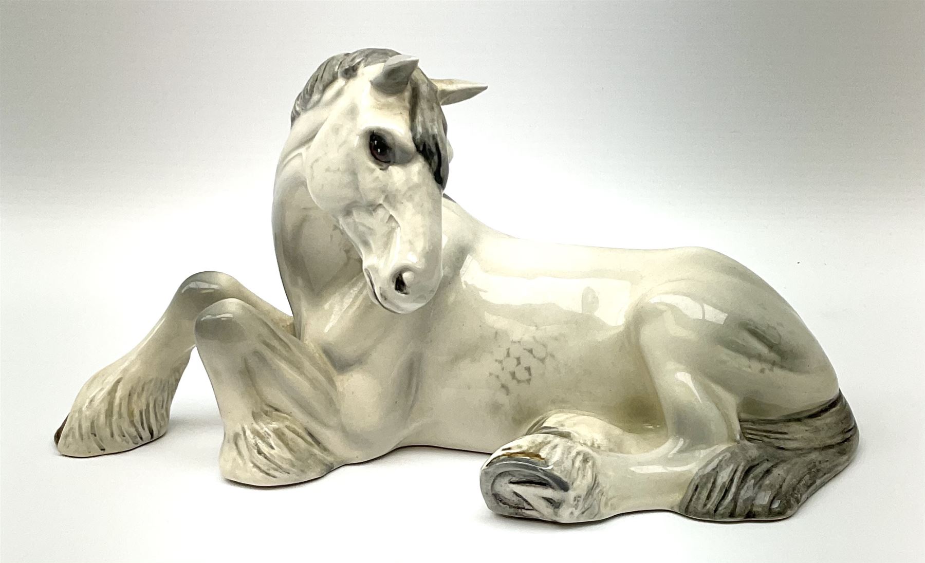 Beswick dapple grey Shire horse lying down model no 2459, with printed mark beneath. 
