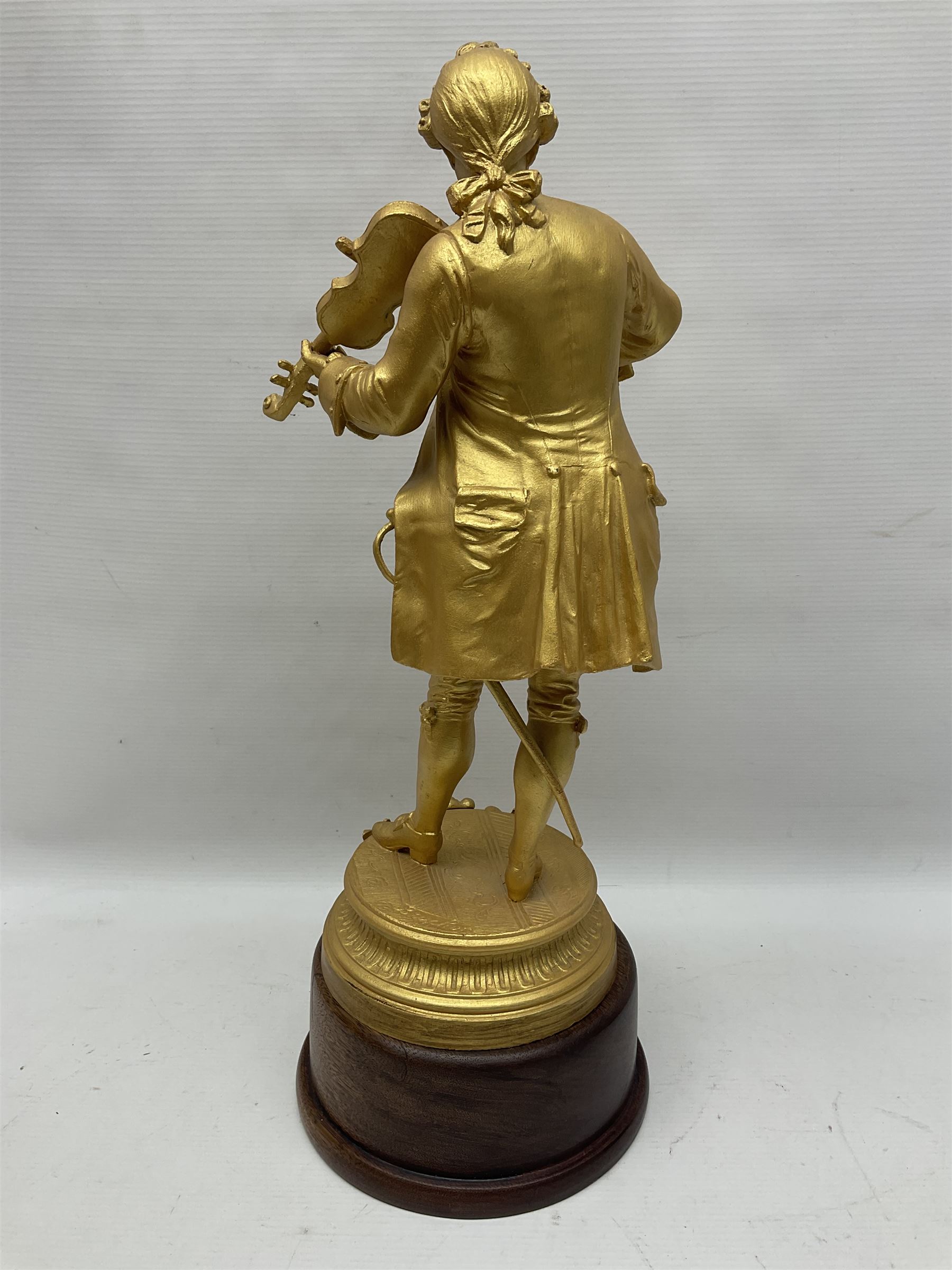 After Émile Bruchon, Mozart, gold painted figure upon a wooden plinth, H51cm