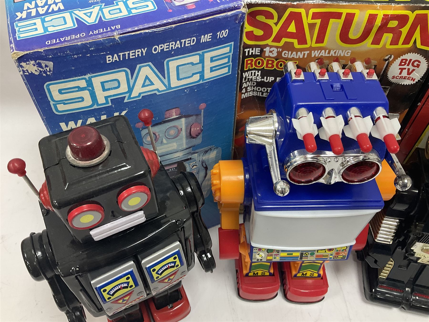 Three vintage battery operated robots comprising tin-plate Space Walk Man ME 100 Robot, Saturn the 13