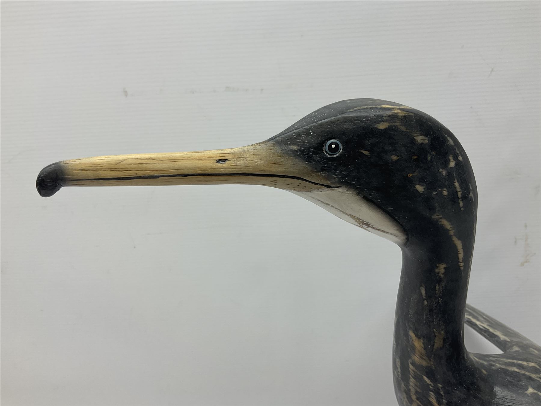 Wooden sculpture of Cormorant aquatic bird on a naturalistic wooden plinth, H46cm
