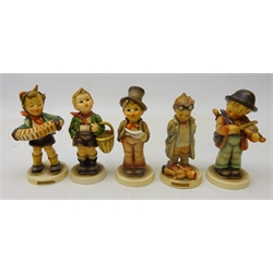  Five Goebel Hummel figures 'Village Boy', 'Accordion Boy', 'Little Fiddler', 'Street Singer' & 'Doctor' (5)  