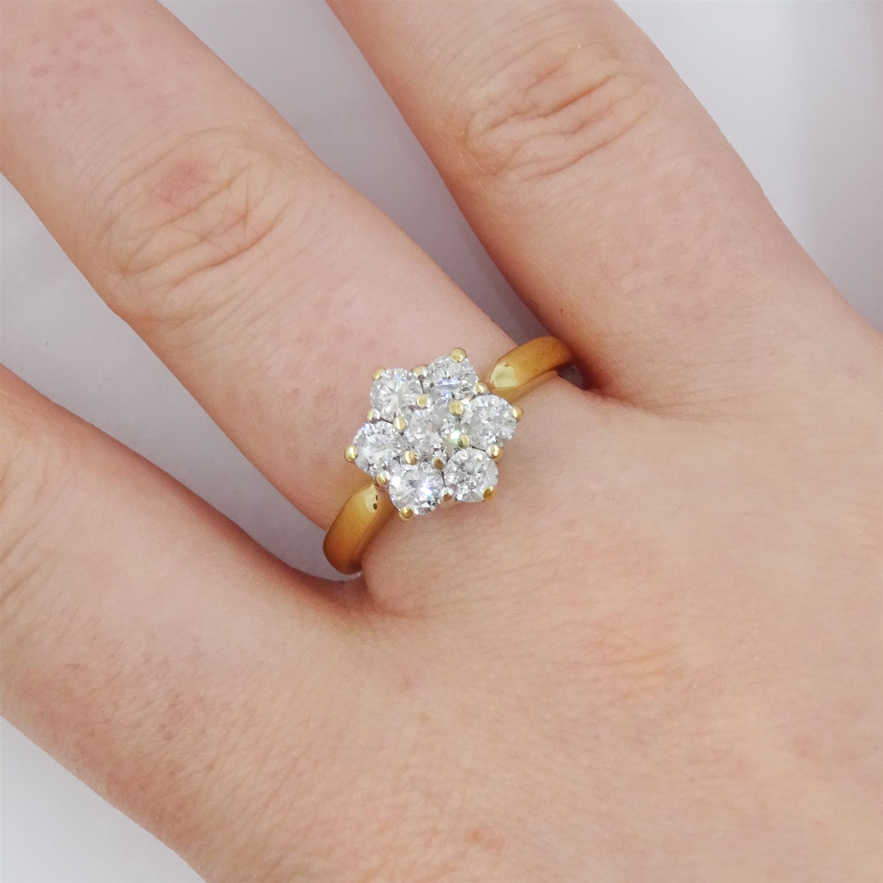 18ct gold seven stone round brilliant cut diamond flower head cluster ring, hallmarked, total diamond weight 1.00 carat