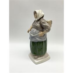 A Bing and Grondahl figure modelled as a fisherwoman, 1702, with printed and painted marks beneath, H27cm.