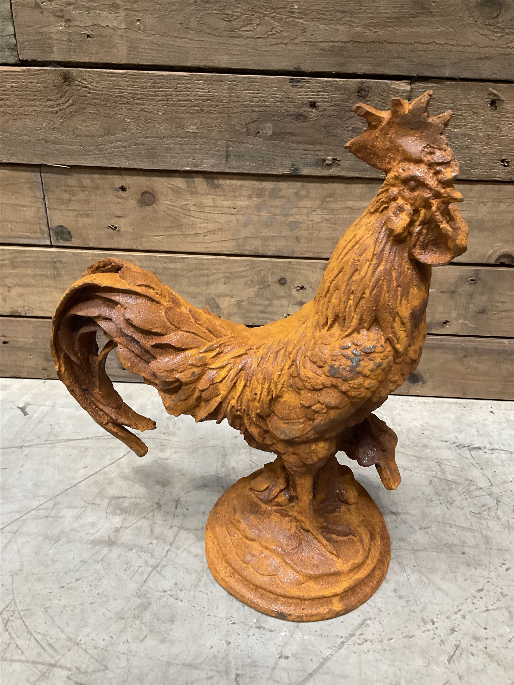 Small weathered cast iron garden cockerel