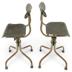 Pair of mid 20th century 'Tan-Sad' industrial chairs, black moulded fibre seats, raised on four supports