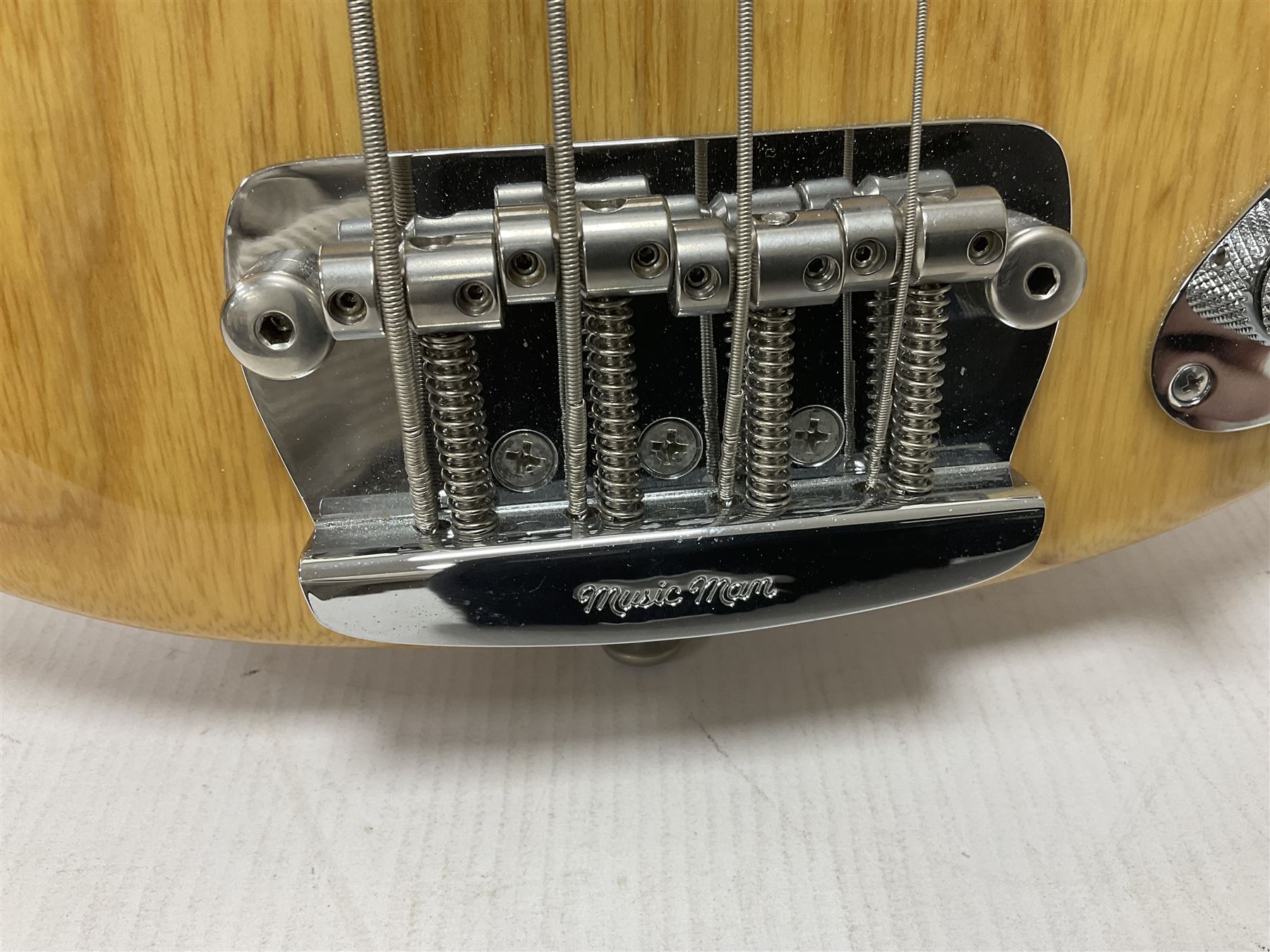 Ernie Ball Music Man Sting Ray 4 string bass guitar, in natural finish with roasted maple neck and tortoiseshell effect scratch guard, serial no 87485, in black Music Man hard case, guitar L114cm