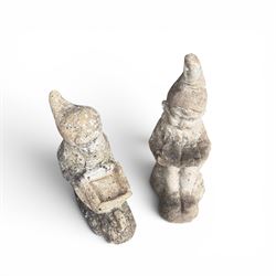 Two seated cast stone garden gnomes