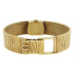 Omega ladies 9ct gold manual wind wristwatch, champagne dial with baton hour markers, on integral 9ct gold bracelet, London 1956