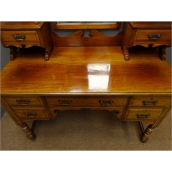  Edwardian walnut dressing table, raised back with swing mirror and small two trinket, five drawers to base, turned supports joined by moulded stretchers, W118cm, H180cm, D55cm  