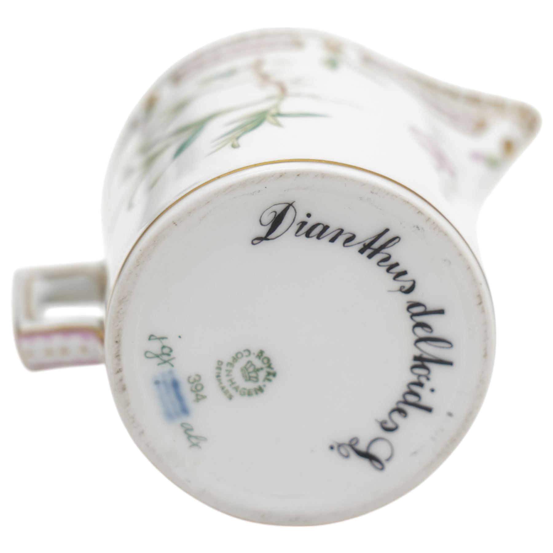Royal Copenhagen Flora Danica wares, comprising covered mustard pot with naturalistically modelled vine handles and decorated with Cushion Pink (Cucubalius Acaulis) H8cm, milk jug decorated with Maiden Pink (Dianthus Deltoides) H7cm, covered dish decorated with Dwarf Milkwort (Polygala Amarum) W8cm, oval salt cellar decorated with Alpine Squill (Scilla Bifolia) W11cm, egg cup, pin dish and cased hand mirror, various Latin specimen inscriptions to base, all with printed and painted marks beneath (7)