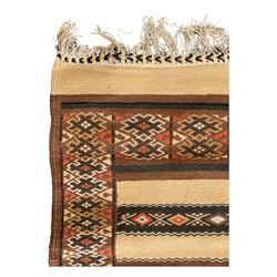 Turkish Kilim ground rug, the field with alternating horizontal bands of geometric patterns, bordered by repeating diamond motifs (145cm x 242cm); Turkish red ground rug, the field with three octagonal medallions (113cm x 172cm) (2)