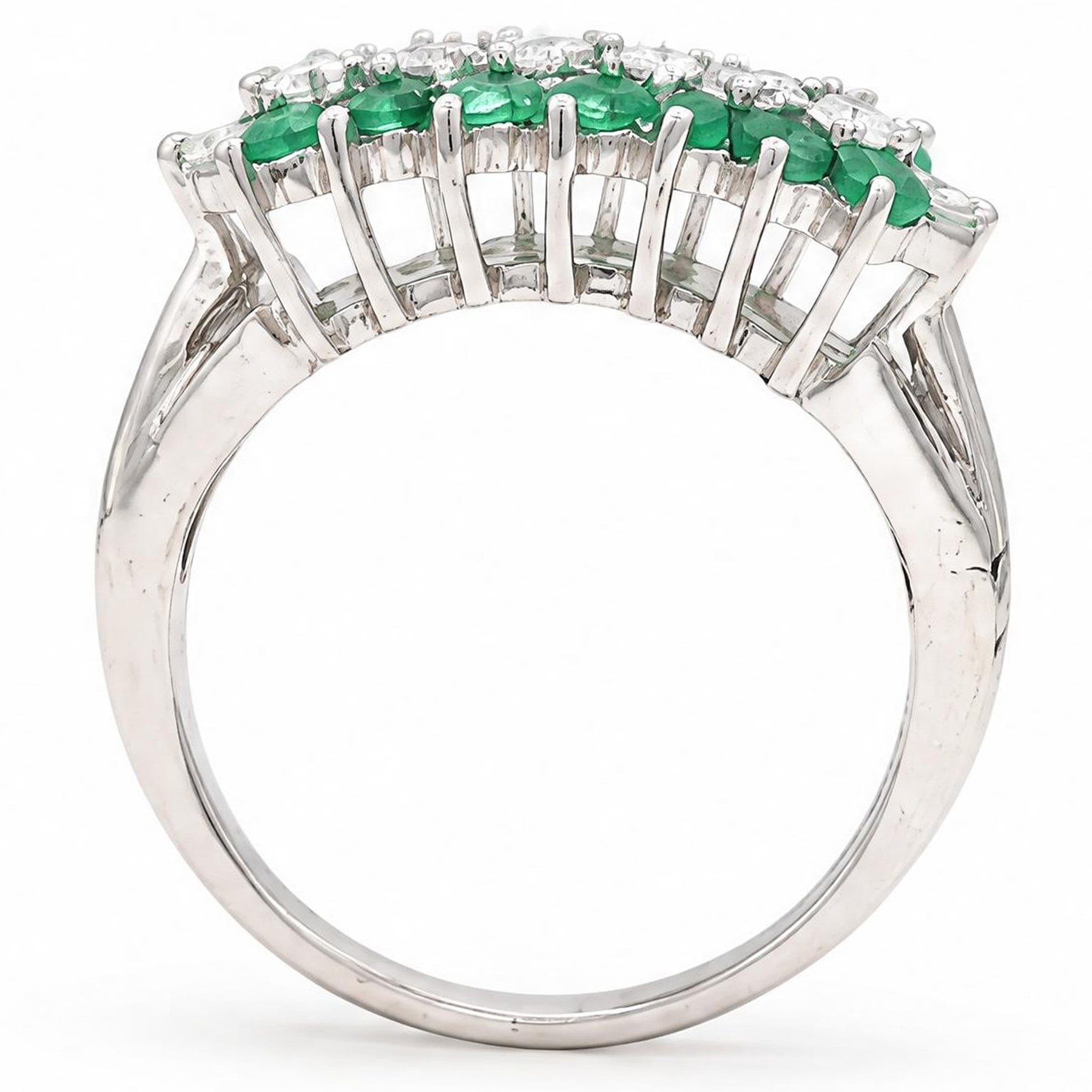 18ct white gold three row diamond and emerald ring, set with eight round brilliant cut diamonds and a row of seven emeralds set either side, total diamond weight approx 0.30 carat