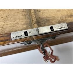 Victorian oak tantalus, mirrored high-back with recess for housing the decanters, behind a hinged box, with cribbage board to the concealed drawer below, marked Barman, London, H33cm, L37cm