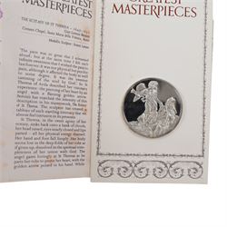 John Pinches 'The 100 Greatest Masterpieces' set of one hundred silver medallions, each on presentation card with information leaflet, together with the corresponding wooden display cabinet