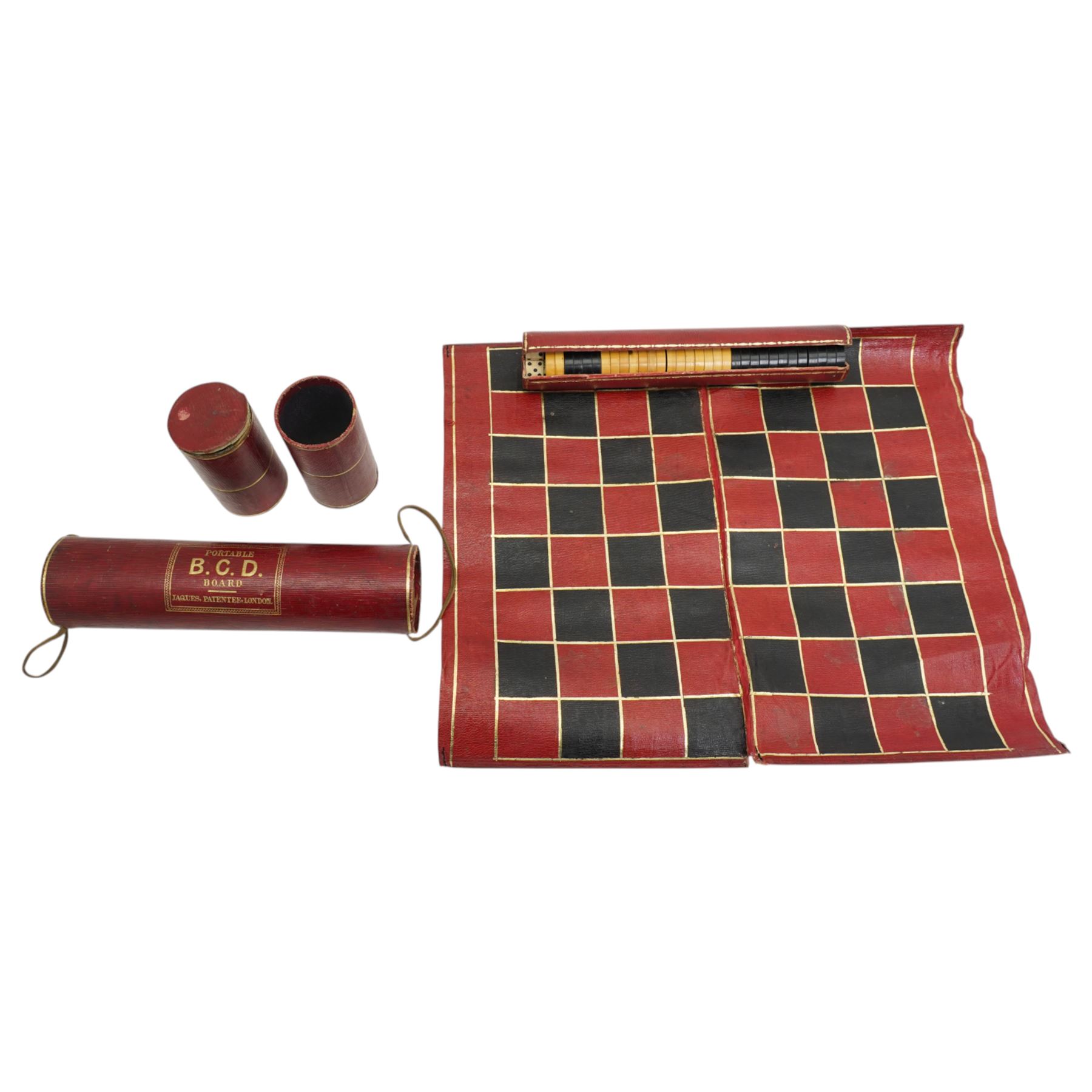 Jaques of London portable B.C.D. board for Backgammon, Chess and Draughts, the inner tube containing thirty two counters and two dice, outer red leather case