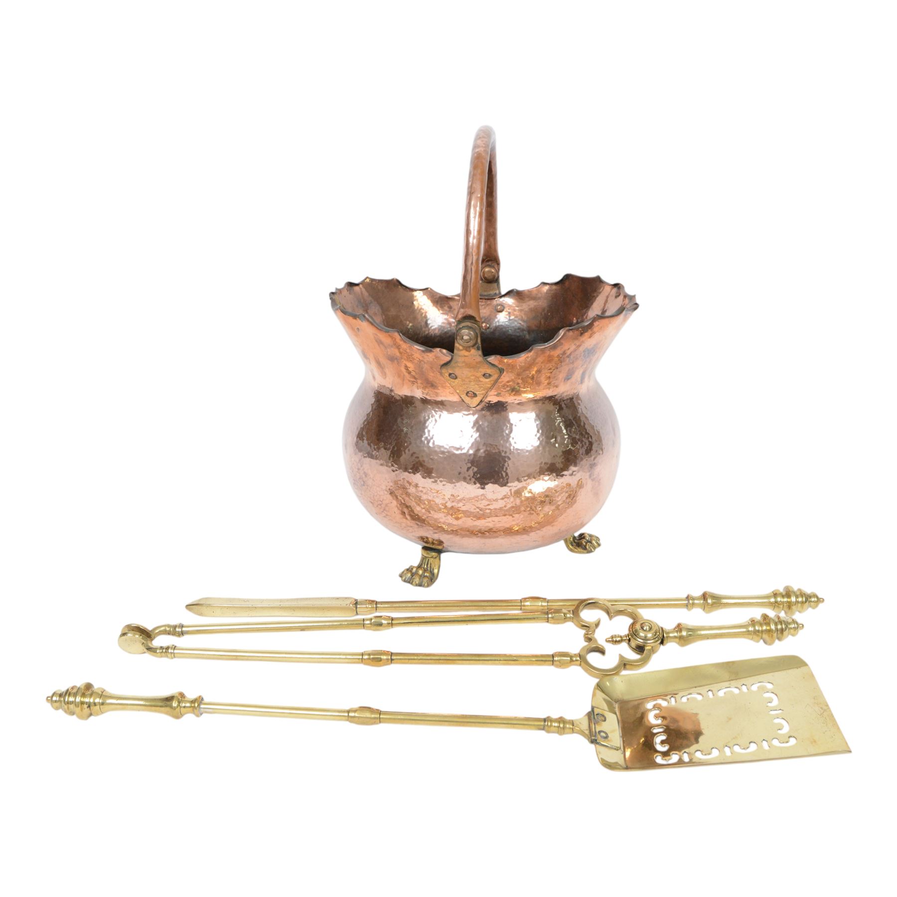 Victorian copper coal bucket, of bellied form with swing handle, upon three brass lion paw feet, not including handle H33cm, together with brass fireside accessories