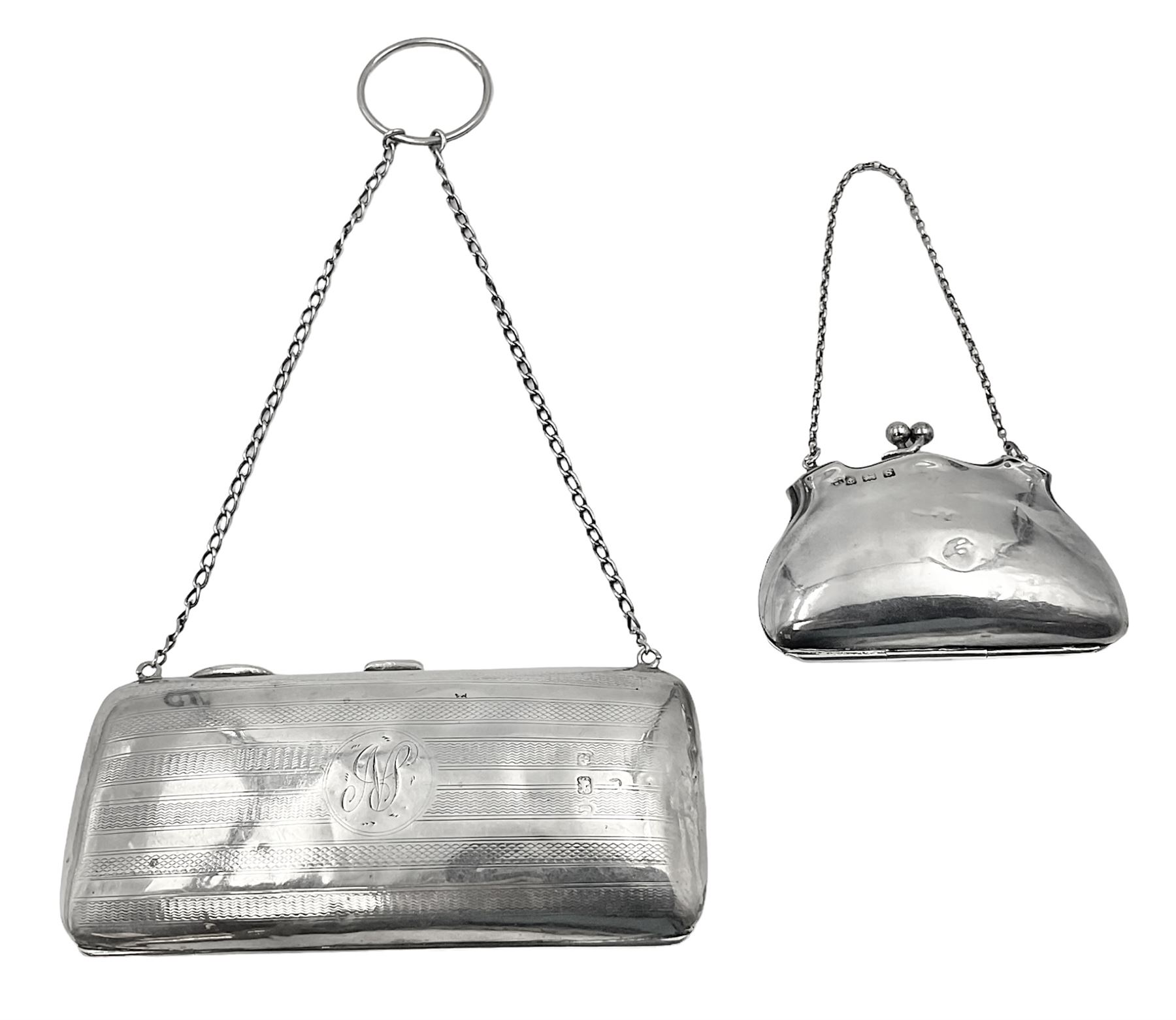 Early 20th century silver mounted coin purse, with leather interior and finger chain, hallmarked Samuel M Levi, Birmingham 1917, together with a similar Edwardian example, with engraved initials and engine turned decoration, hallmarked Birmingham 1907, maker's mark worn and indistinct, largest W11.3cm