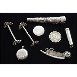 Edwardian silver sovereign holder by A & J Zimmerman Ltd,  Birmingham 1902, silver whistle by John Bettridge, Birmingham 1824, pair of silver knife rests by Josiah Williams & Co, London 1919, silver cheroot holder, Victorian 1889 silver crown, pill box and a silver Middle Eastern embossed mount