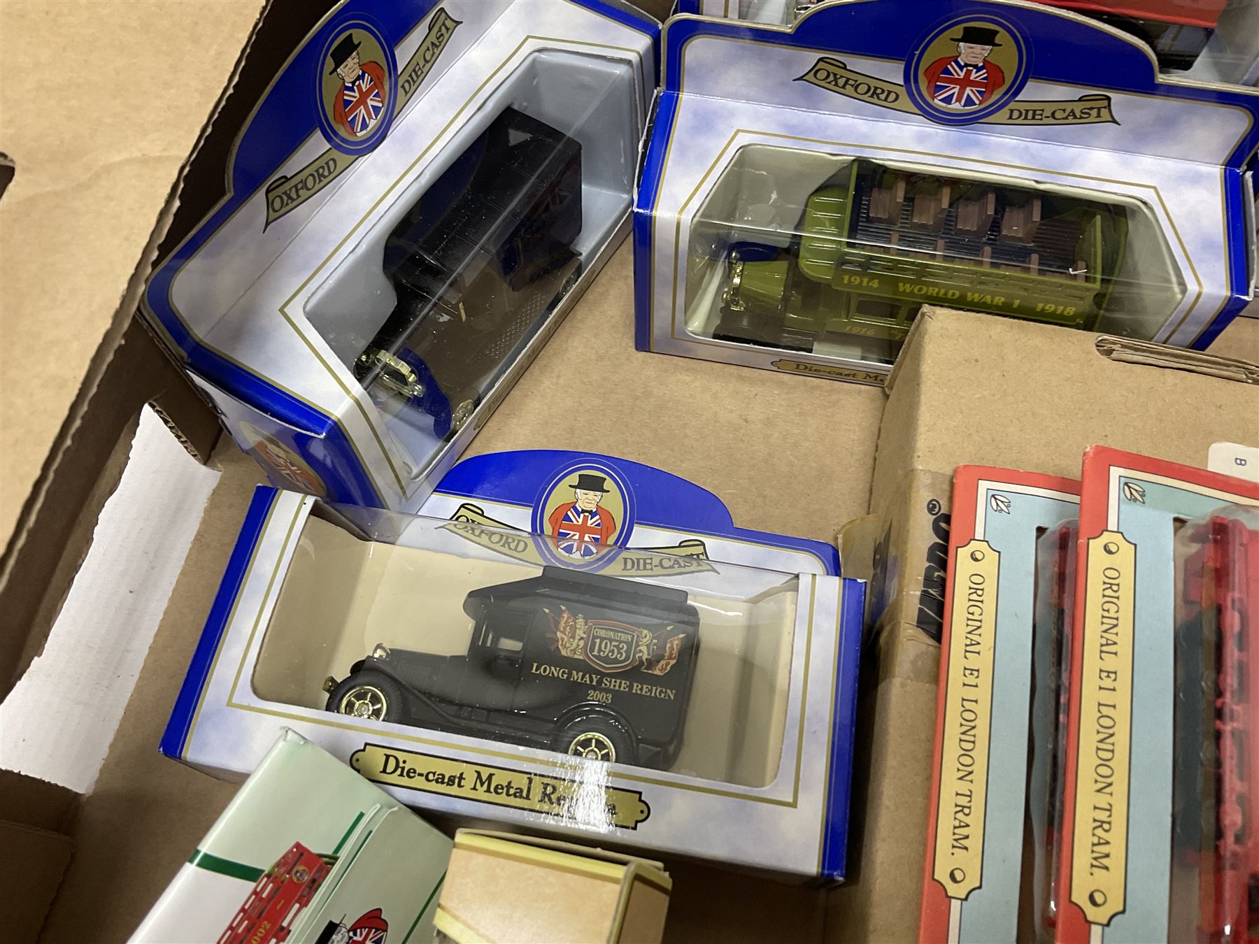 Collection of Tetley Tea collectibles to include sixteen 1:43 scale model cars from Lledo and Oxford Die-Cast with further Tetley Tea figures and tinned coaster set