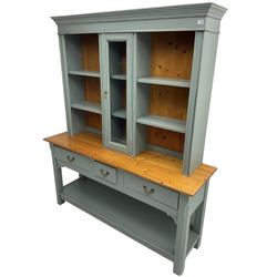 20th century blue-grey painted pine kitchen dresser, fitted with central glazed cupboard flanked by four shelves over three drawers, raised on square chamfered supports united by undertier