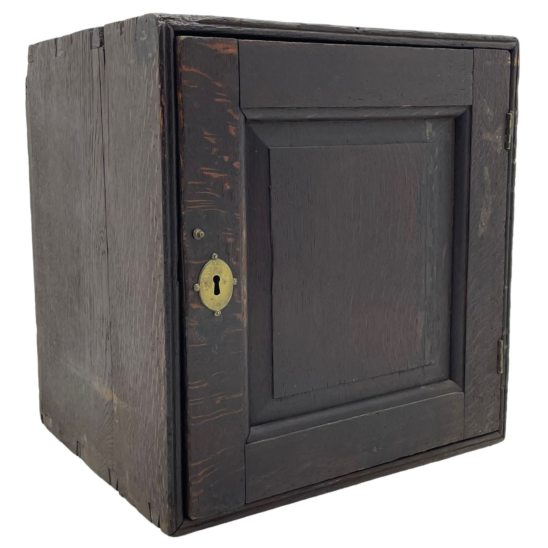 18th century oak spice cupboard, single panelled door enclosing eight drawers of various sizes, reed moulded front edges