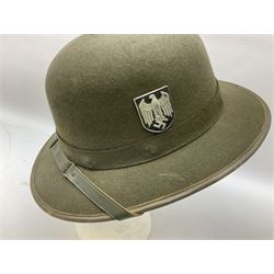 Five reproduction German WW2 hats comprising Wehrmacht olive tropical helmet, Heer officer's peaked cap, two M43 caps and Field side cap (5)