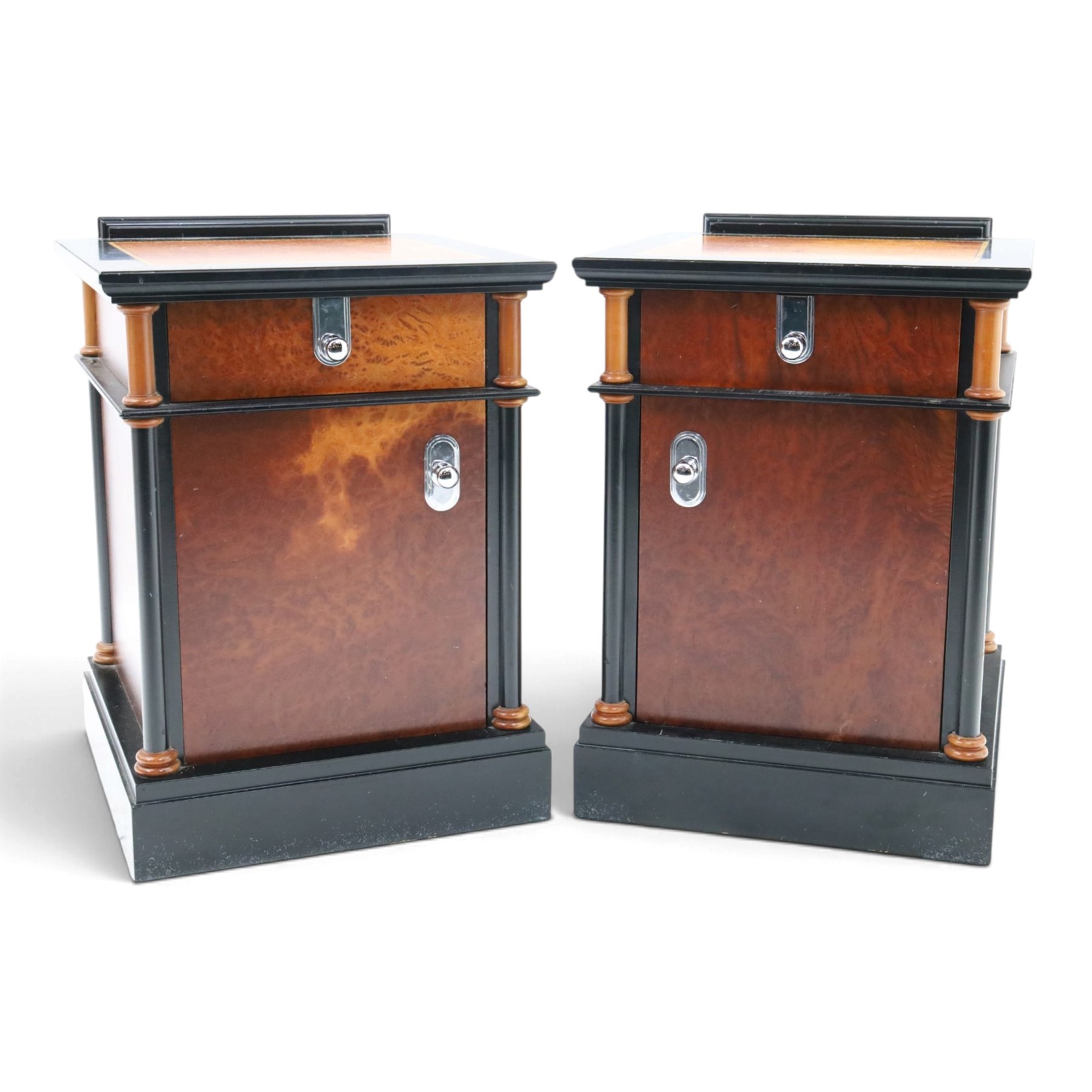 Pair of Art Deco design burr walnut and ebonised bedside cabinets, rectangular inset tops with raised rear galleries, each fitted with a drawer above a cupboard, flanked by cylindrical columns, on plinth bases