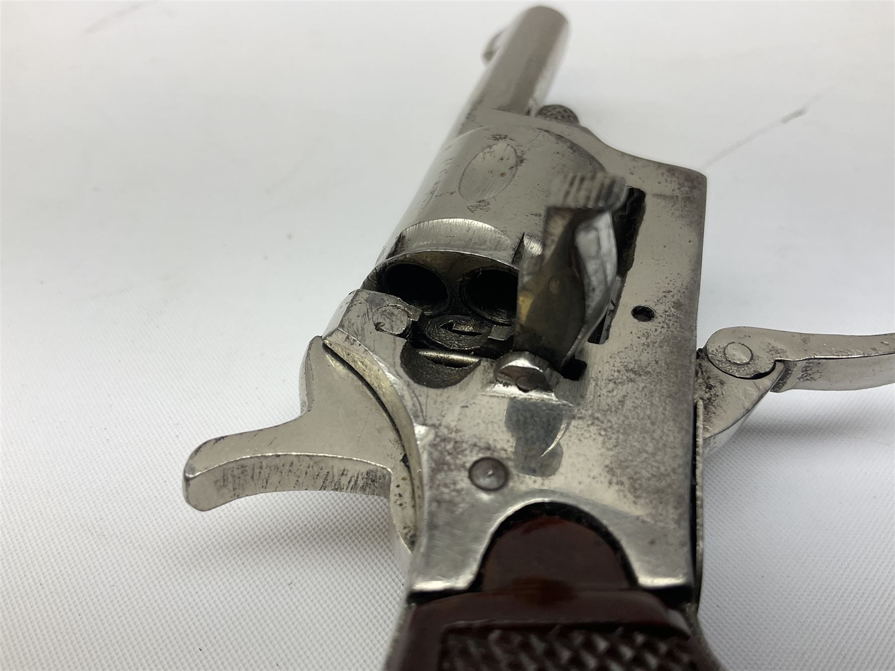 Early 20th century Flobert 5mm blank firing revolver with six-shot chamber, top venting, nickel plated with folding trigger No.118 L12.5cm overall; replica non-firing 'British Bulldog' revolver; and Windproof gas lighter inscribed 'Revolver-99 Spring and Autumn' in holster marked 'Star-Line'