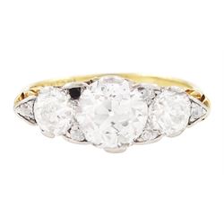 Early 20th century gold and platinum diamond ring, three graduating old cut diamonds, with...