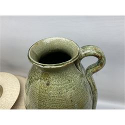 Large cream crackle glaze table lamp, together with a tall studio pottery vase in green with single loop handle, with impressed makers mark, H49cm
