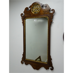  Chippendale style walnut fret work parcel gilt wall mirror, (W50cm, H93cm) and an oval bevel edge mirror (W81cm, H54cm)  
