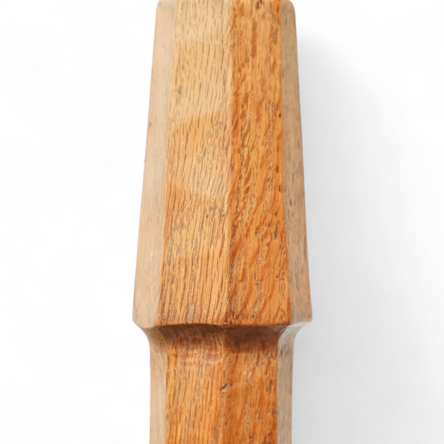 Squirrelman - oak standard lamp, the octagonal stepped base carved with the signature squirrel, the tapering octagonal column rising to a brass fitting, by Wilfrid Hutchinson, Husthwaite