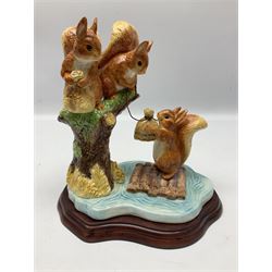 Four Border Fine Arts Beatrix Potter figures, comprising Tableau created to commemorate the Millenium together with a Border Fine Arts Limited Edition no 669814, The Tale of Peter Rabbit Tablet A1306, Four Little Rabbits A2442 and Sailing Home A2443
