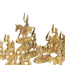 19th century Moghul Indian silver and silver gilt chess set, comprising thirty-two pieces, modelled as soldiers mounted upon elephants, camels and horses with the pawns on foot, unmarked, King H10cm
