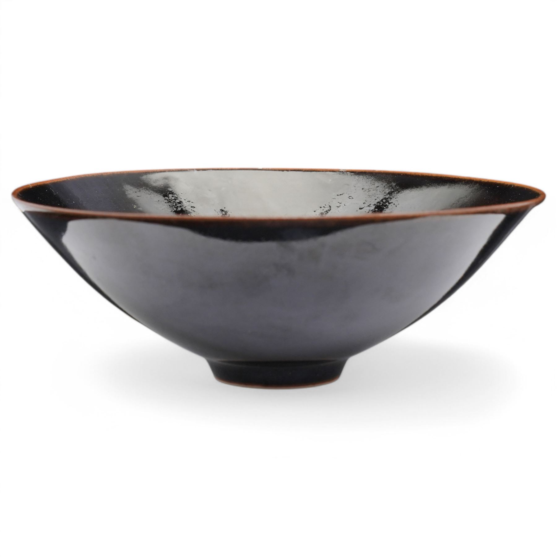 Poh Chap Yeap (Chinese/British 1927-2007); tenmoku glazed tea bowl with small circular foot, incised signature to base, D14cm
