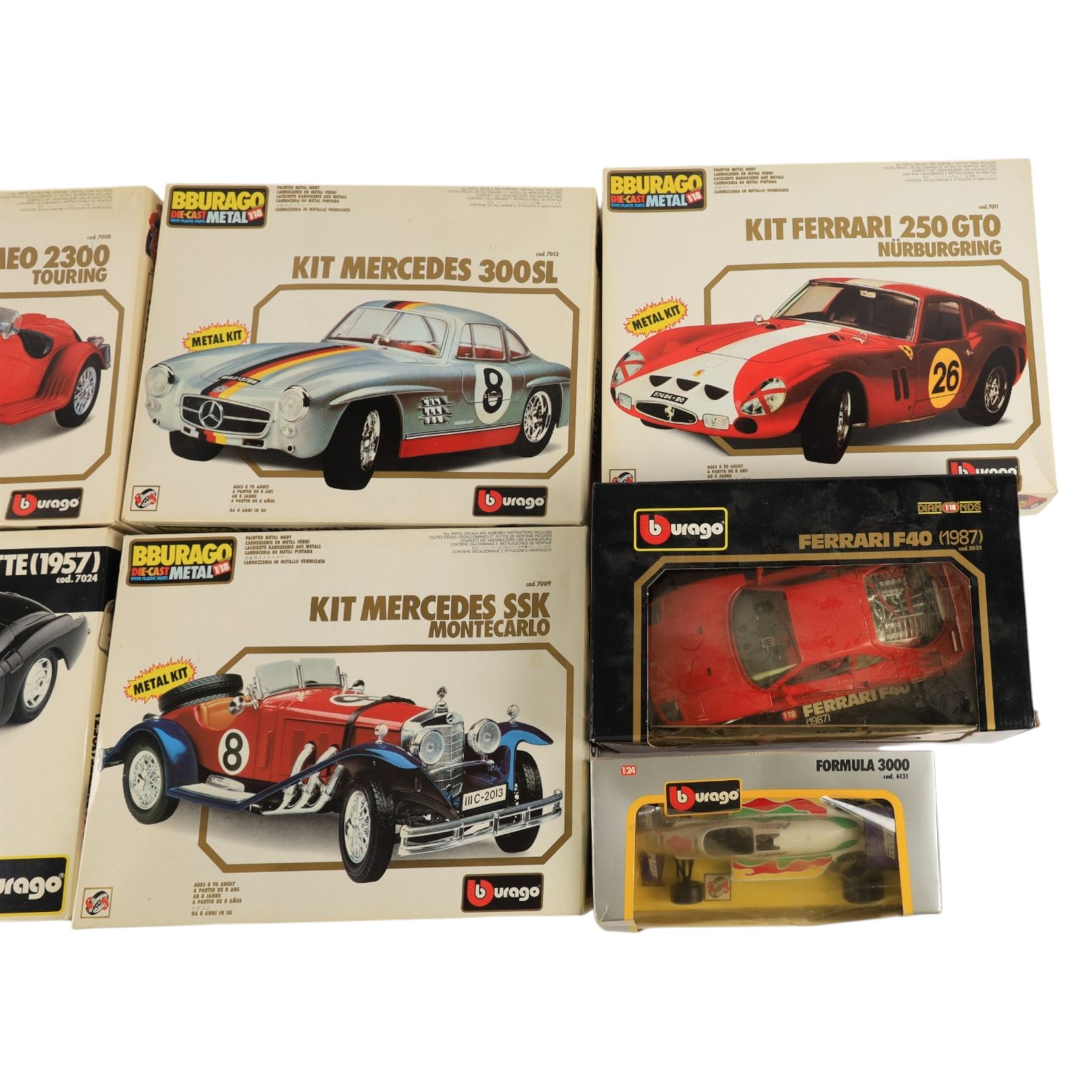 Five Bburago kit built cars and two Bburago diecast models