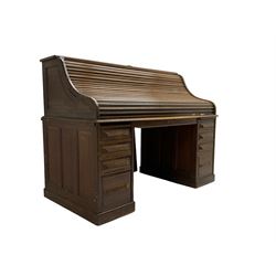 Cutler - early 20th century American oak tambour roll-top desk, the twin pedestals fitted with four graduating drawers